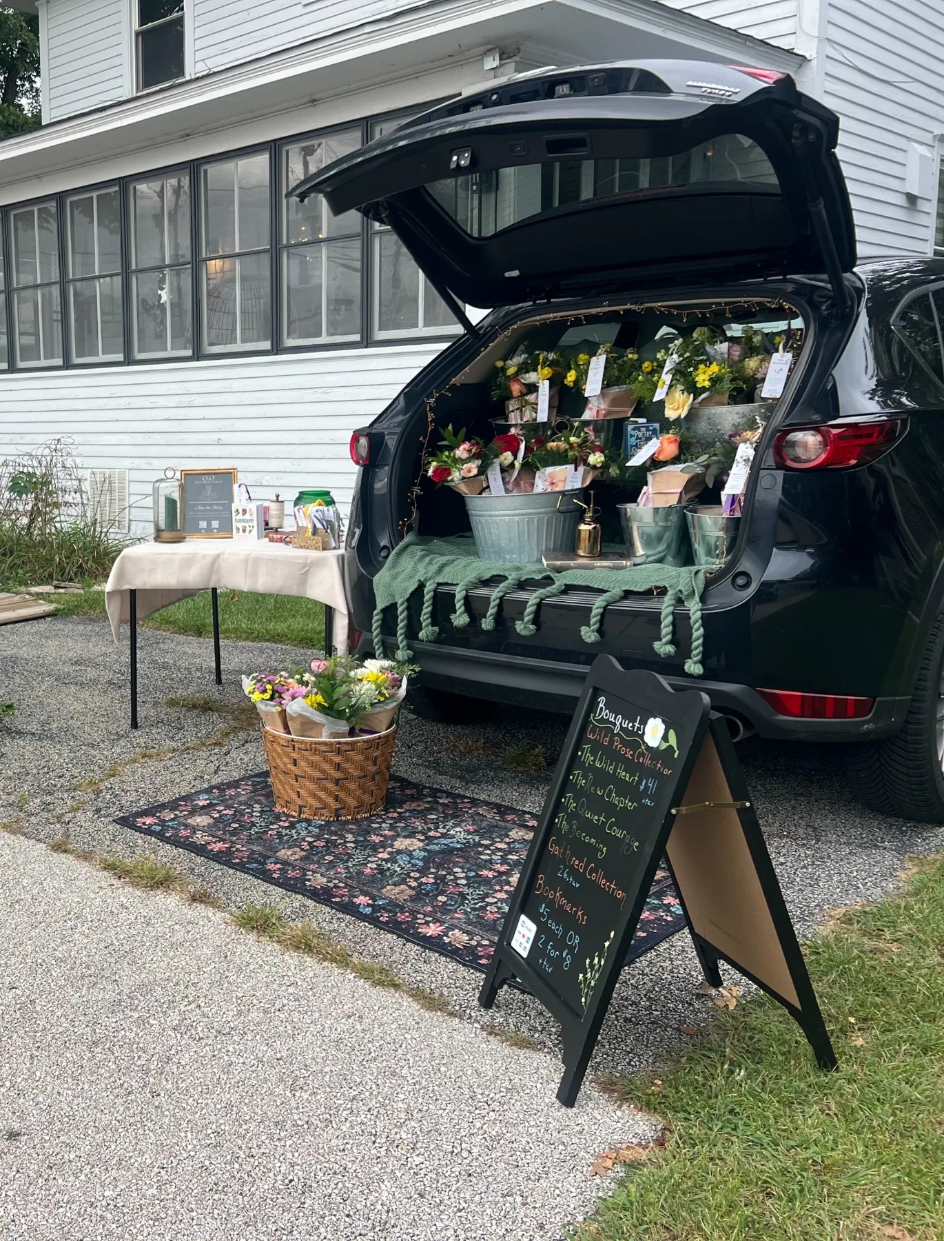 Wild Prose Floral mobile SUV pop-up with flower buckets and chalkboard